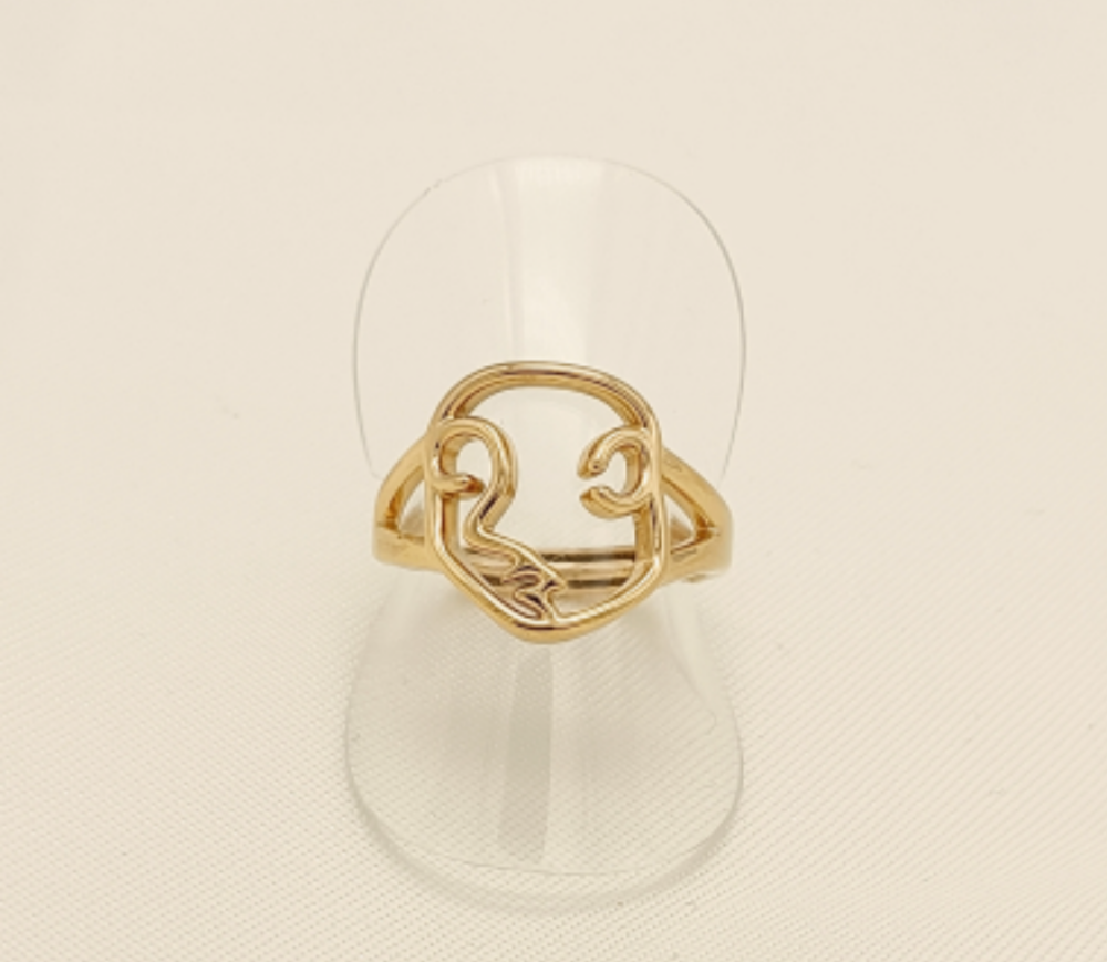 Bague dorée visage abstrait